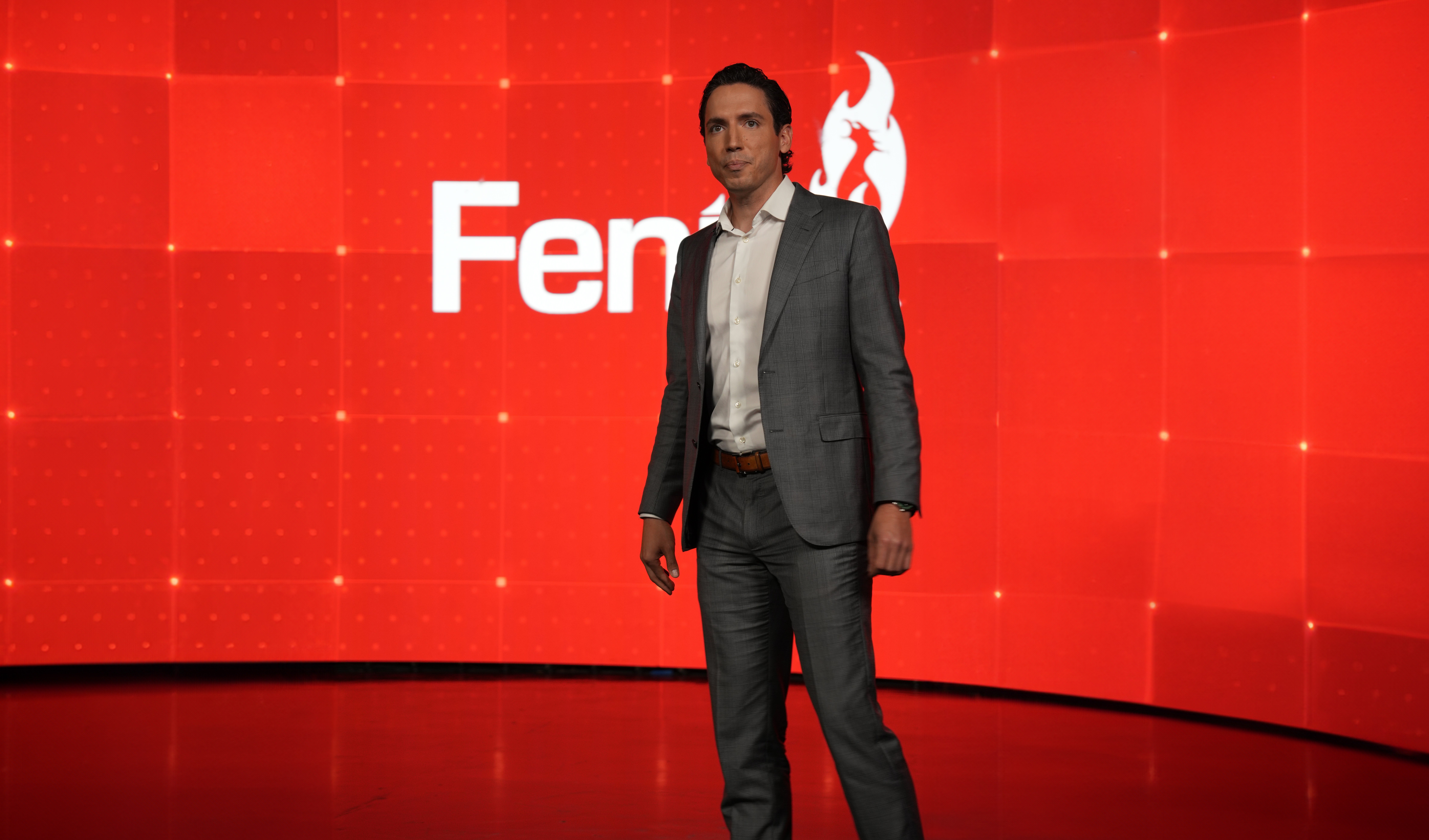 Hamza on Stage (Red Background with White Feniex Logo) 2